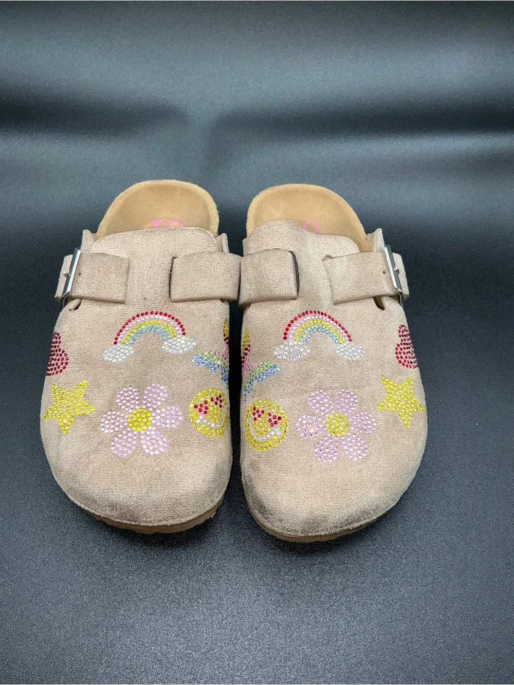 Yoki Gienna girls' taupe faux suede clogs featuring rhinestone embellishments.